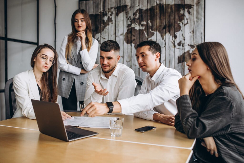 group of people working out business plan in an office